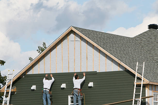 Professional Storm Damage Siding Repair technician working in Victoria, VA